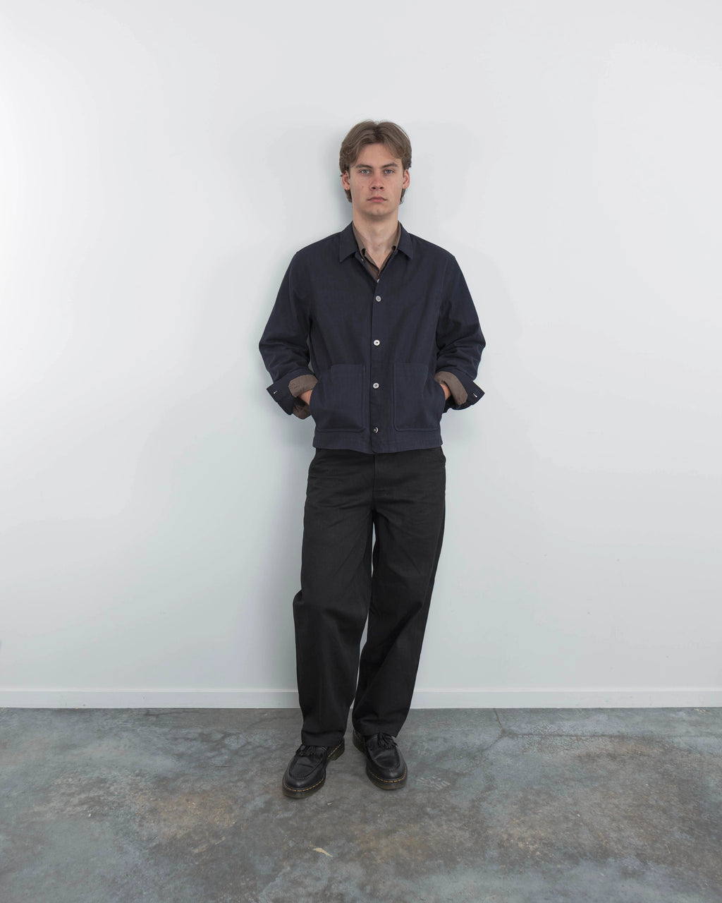 Model wearing Anderson navy chore coat, campaign shoot