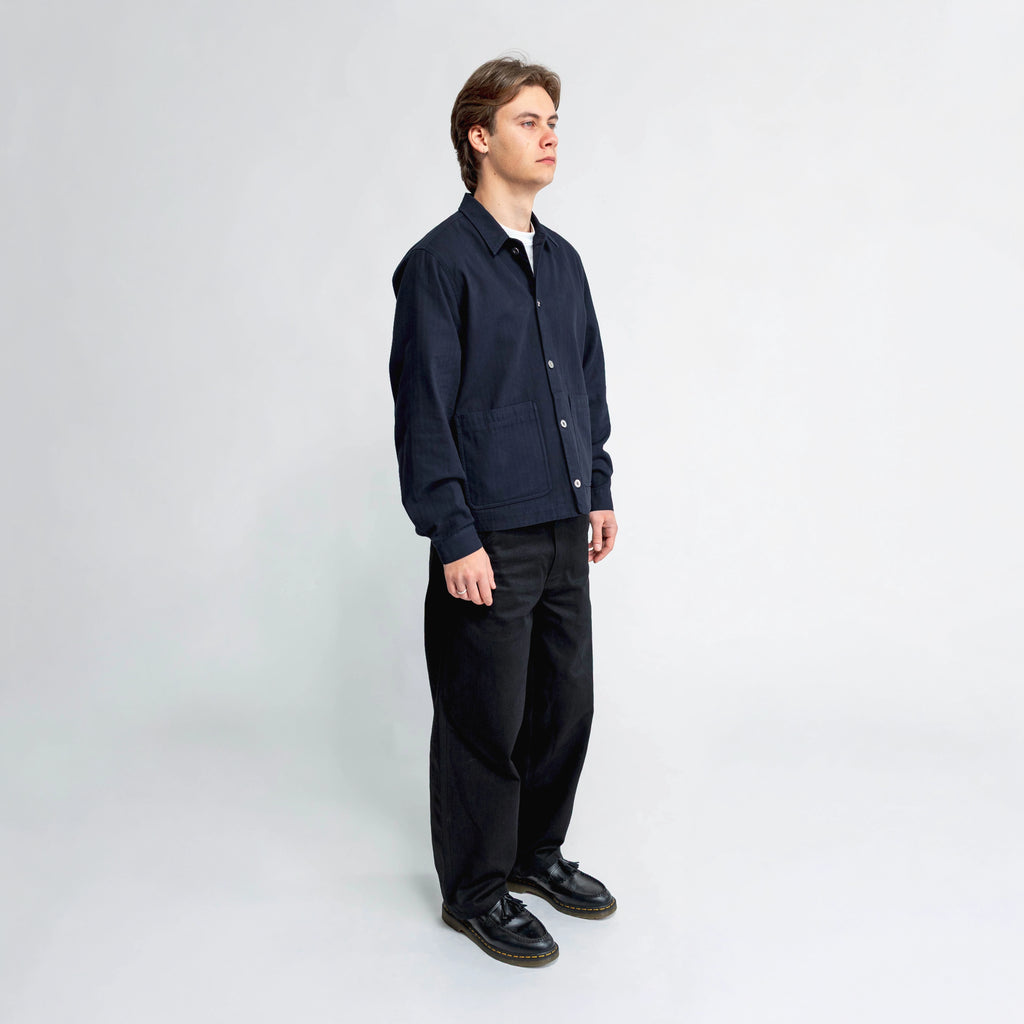 Anderson navy chore jacket, side view showing double-entry pocket