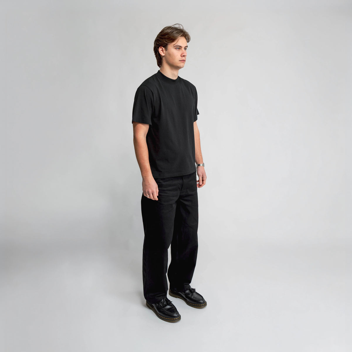 Anderson Relaxed T-Shirt in black, side view showing relaxed fit